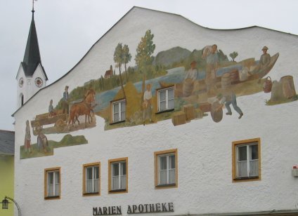 Marktl Chemist with village church in background.